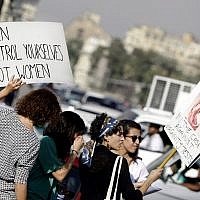 Illustrative: In this June 14, 2014 photo, Egyptian women hold banners during a protest against sexual harassment in Cairo, Egypt. (AP Photo/Amr Nabil)