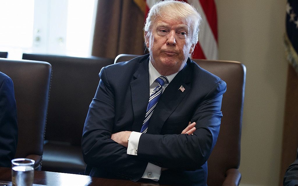 In this March 8, 2018, file photo, President Donald Trump listens during a cabinet meeting at the White House in Washington. (AP Photo/Evan Vucci)