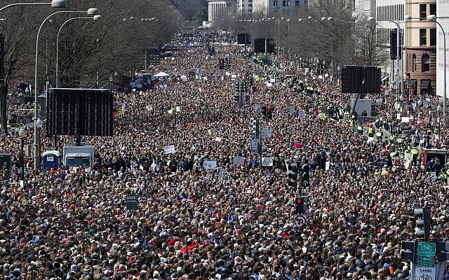 Looking west from the stage area, the crowd fills Pennsylvania Avenue during the 'March for Our Lives' rally in support of gun control, Saturday, March 24, 2018, in Washington. (AP Photo/Alex Brandon)
