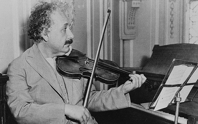 Albert Einstein is shown playing the violin, date and location unknown (AP Photo)