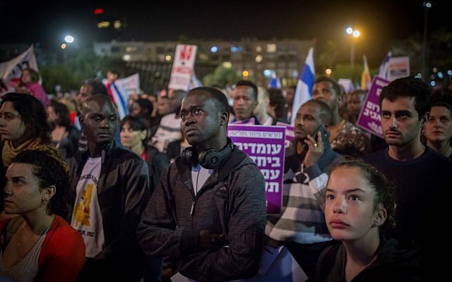 African asylum seekers and activists protest plans to deport migrants, at Rabin Square in Tel Aviv, on March 24, 2018. (Miriam Alster/ Flash90)