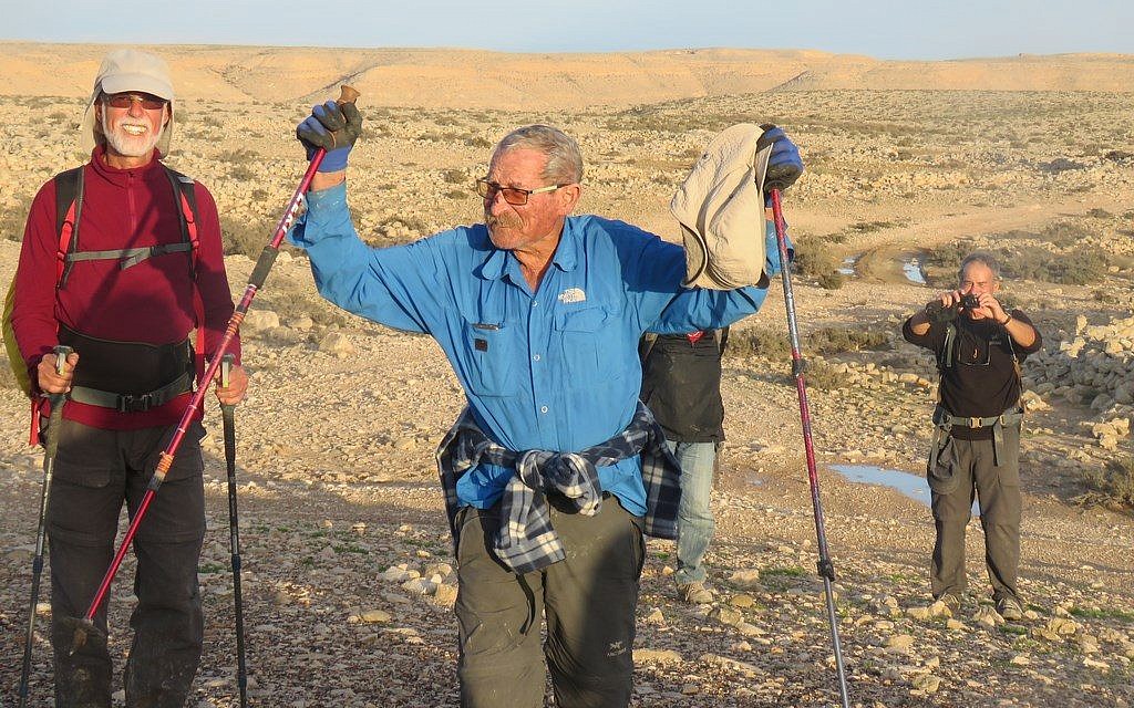 Trip leader Shuka Revak, 86, fulfills a life-long dream as he reaches Avdat in Israel from Jordan's Petra, February 2018. (courtesy)