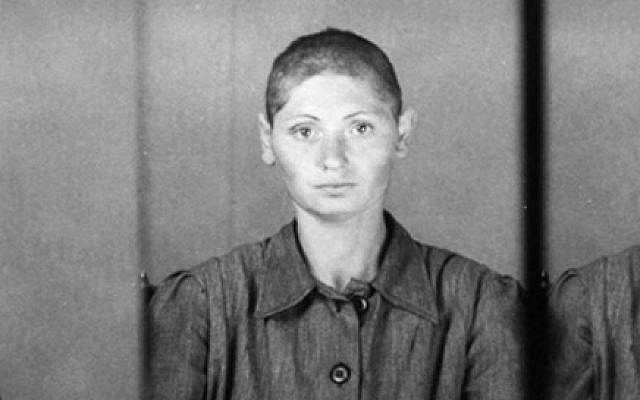Jewish prisoner no. 13088, after her hair is shorn in Auschwitz. (Yad Vashem)