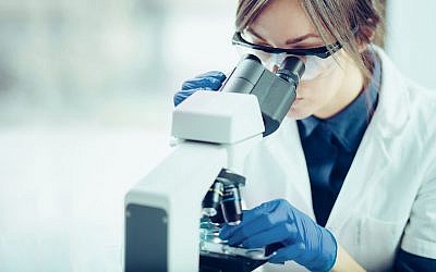 Illustrative image of a scientist in a lab (Likoper, iStock by Getty Images)