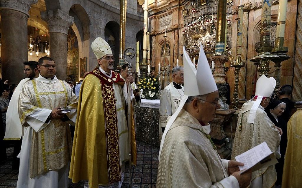 The head of the Roman Catholic Church in the Holy Land, Apostolic Administrator of the Latin Patriarchate Pierbattista Pizaballa leads the Easter Sunday procession, on April 1, 2018, at the Church of the Holy Sepulchre (AFP PHOTO / GALI TIBBON)