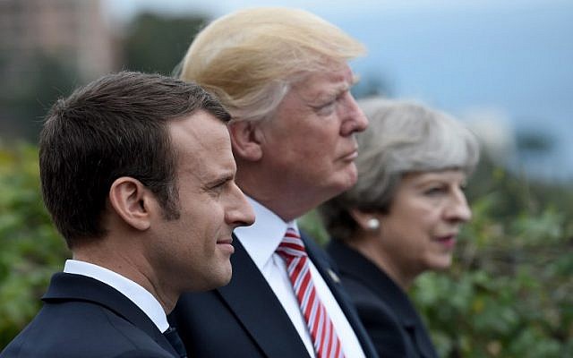 This file photo taken on May 26, 2017 shows (L-R) French President Emmanuel Macron, US President Donald Trump and Britain's Prime Minister Theresa May attending the Summit of the Heads of State and of Government of the G7 plus the European Union in Taormina, Sicily. (AFP PHOTO / STEPHANE DE SAKUTIN)