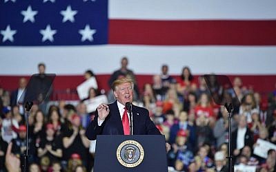 US President Donald Trump speaks during a rally at Total Sports Park in Washington, Michiga