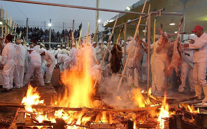 Samaritans take part in the traditional Passover sacrifice ceremony, where sheep and goats are slaughtered, at Mount Gerizim near the northern West Bank city of Nablus on April 29, 2018. (AFP)