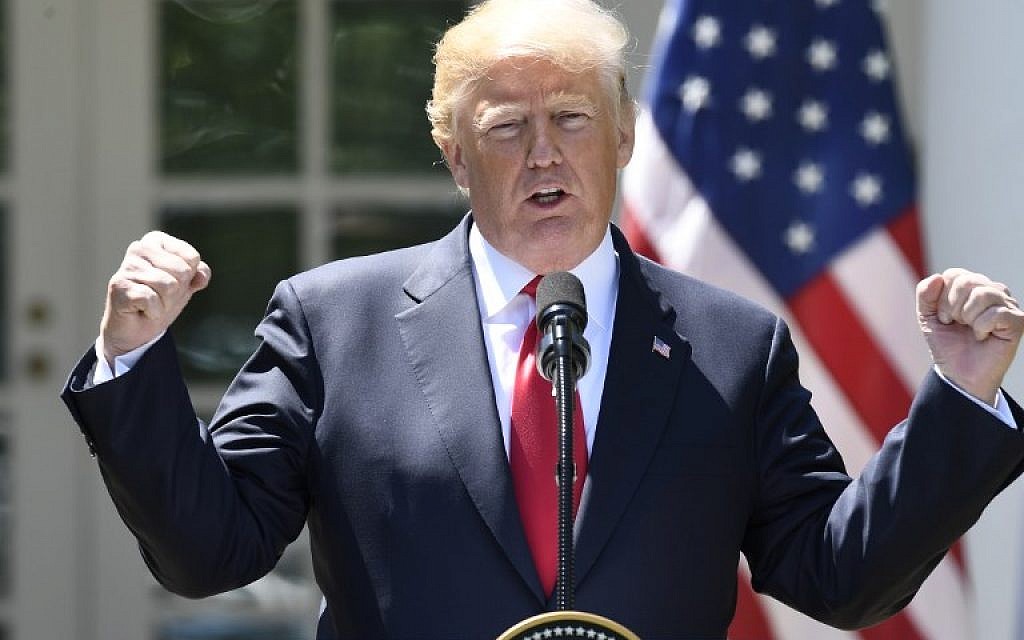 US President Donald Trump speaks during a joint press conference with Nigerian President Muhammadu Buhari in the Rose Garden of the White House on April 30, 2018, in Washington, DC. Trump said the current Iranian nuclear deal was "unacceptable." (AFP PHOTO / SAUL LOEB)