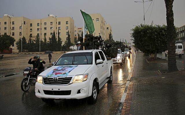 Members of of Hamas's armed wing ride vehicles on the streets of Beit Lahiya, Gaza Strip, Thursday, Dec. 8, 2016. (AP Photo/Adel Hana)