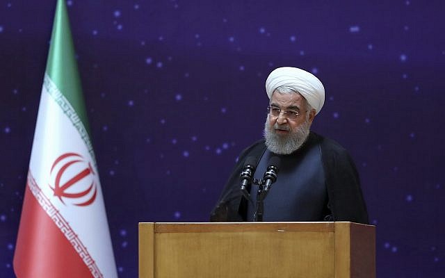 Iranian President Hassan Rouhani speaks in a ceremony to mark "National Nuclear Day," dedicated to the country's achievements in nuclear technology, in Tehran, Iran, April 9, 2018. (Iranian Presidency Office via AP)