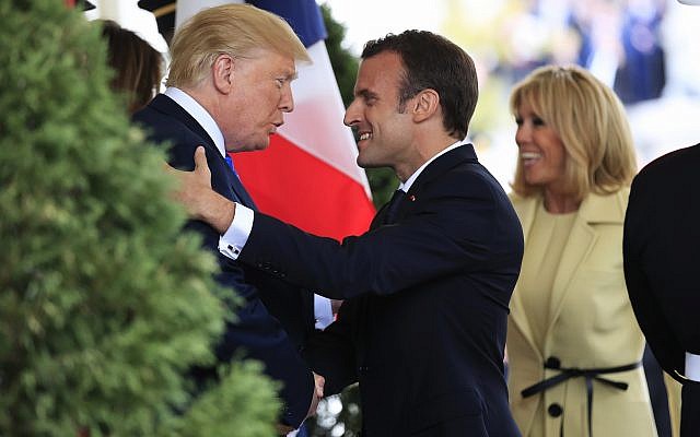 US President Donald Trump with first lady Melania Trump greet visiting French President Emmanuel Macron and his wife Brigitte Macron upon arrival at the White House in Washington, April 23, 2018. (AP Photo/Manuel Balce Ceneta)