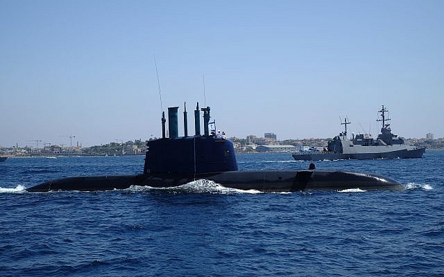 File: An Israeli Navy submarine sails in front of a Sa'ar 5-class corvette in the waters south of Tel Aviv as part of the Israeli Navy's flotilla in honor of Israel's 70th Independence Day on April 19, 2018. (Judah Ari Gross/Times of Israel)