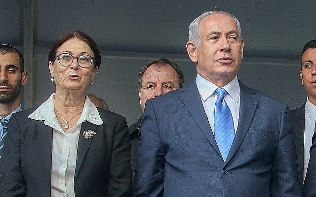 Prime Minister Benjamin Netanyahu, right, with Supreme Court Chief Justice Esther Hayut, at the Mount Herzl cemetery in Jerusalem, November 1, 2017. (Marc Israel Sellem/Pool)