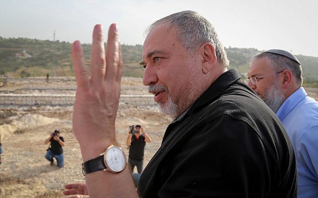 Defense Minister Avigdor Liberman at a cornerstone laying ceremony for a new neighborhood in the Etzion settlement bloc meant to resettle the evacuees of Netiv Ha'avot outpost on March 27, 2018. (Gershon Elinson/Flash90)