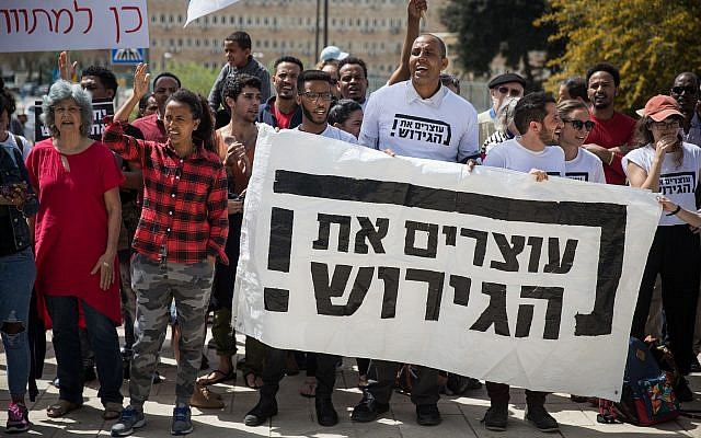 African asylum seekers and Israeli activists protest outside the Prime Minister's Office in Jerusalem, against their deportation, on April 3, 2018. (Hadas Parush/Flash90)