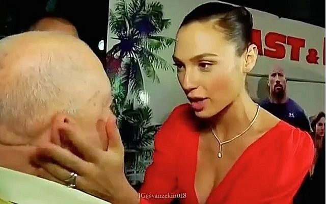 In a screenshot from a video shared by Gal Gadot to mark Holocaust Remembrance Day on April 12, 2018, the Israeli movie star touches the face of her late grandfather Abraham Weiss, a Holocaust survivor whose family was killed at Auschwitz. (Screen capture: Instagram)