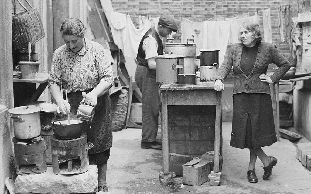 Illustrative: Jewish World War II refugees cooking in an open-air kitchen in Shanghai. (Courtesy Above the Drowning Sea/ Time & Rhythm Cinema)