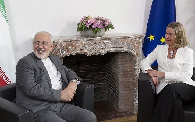 Iranian Foreign Minister Mohammad Javad Zarif (L) meets with European Union foreign policy chief Federica Mogherini to discuss Iran's nuclear deal, on May 15, 2018 at EU headquarters in Brussels. (AFP Photo/Pool/Thierry Monasse)