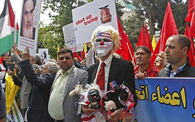 Iranians take part in an anti-US demonstration inside the former US embassy headquarters in the capital Tehran on May 16, 2018. (AFP PHOTO / ATTA KENARE)