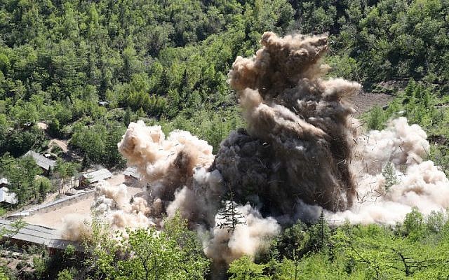 A photo taken on May 24, 2018 shows a general view of a dust cloud surrounding the area near the entrance to a tunnel at North Korea's Punggye-ri nuclear test facility, during a demolition 'ceremony'. (AFP/ Dong-A Iibo / News1)