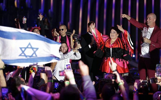 Israel's Netta Barzilai celebrates after winning the Eurovision song contest in Lisbon, Portugal, Saturday, May 12, 2018. (AP Photo/Armando Franca)