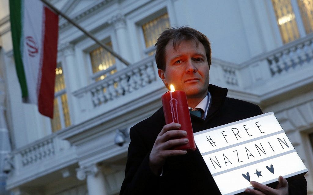 In this file photo dated January 16, 2017, Richard Ratcliffe, husband of imprisoned charity worker Nazanin Zaghari-Ratcliffe, poses for the media during an Amnesty International led vigil outside the Iranian Embassy in London. (AP Photo/Alastair Grant, FILE)