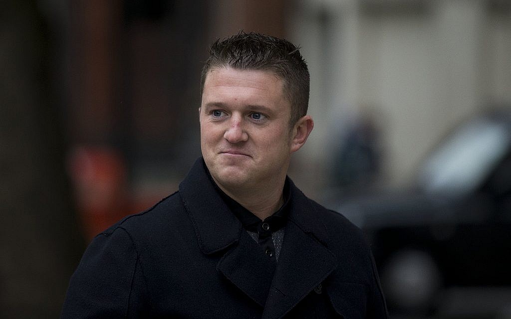 Tommy Robinson, the former leader of the far-right EDL 'English Defense League' group arrives for an appearance at Westminster Magistrates Court in London on October 16, 2013 (AP Photo/Matt Dunham).