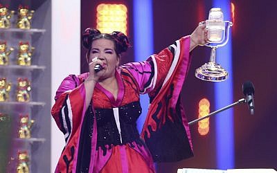 Israel's Netta Barzilai celebrates after winning the Eurovision Song Contest in Lisbon, Portugal, May 12, 2018. (AP Photo/Armando Franca)