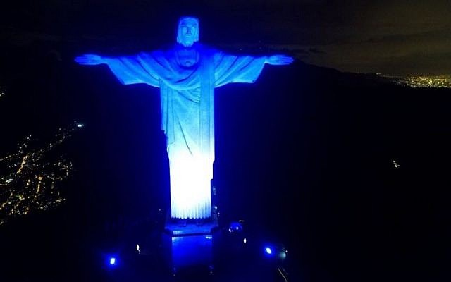 The Christ the Redeemer statue in Brazil's Rio de Janeiro lit in blue and white to mark Israel’s 70th anniversary on May 14, 2018. (Courtesy of Israel’s honorary consulate in Rio via JTA)