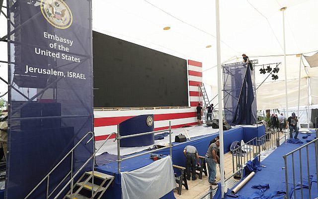 Workers prepare the stage for the official opening ceremony of the US embassy in Jerusalem, May 13, 2018. (Yonatan Sindel/Flash90)
