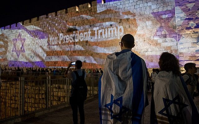 The Israeli and the American flags are screened on the walls of Jerusalem's Old City, on May 13, 2018, on the eve of the opening of the US embassy in Jerusalem. (Yonatan Sindel/Flash90)