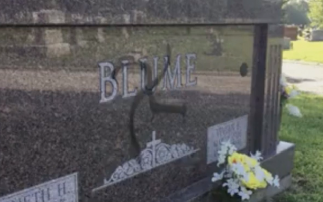 A tombstone vandalized with a swastika at Sunset Hill Cemetery in Glen Carbon, Illinois, on May 27, 2018. (Screen capture: CBS News)