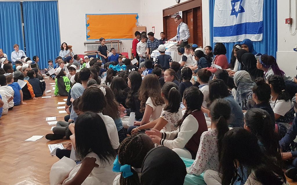 Students at King David Elementary School in Birmingham, England, celebrate Israel’s 70th anniversary, April 19, 2018. (Cnaan Liphshiz/JTA)