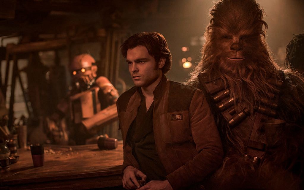 Alden Ehrenreich as Han Solo, along with Chewbacca, in the new movie 'Solo: A Star Wars Story.' (Courtesy Lucasfilm)