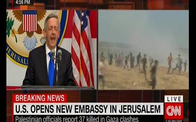 CNN shows the US embassy opening in Jerusalem on a split screen with violence on the Gaza border, May 14, 2018 (Screenshot)