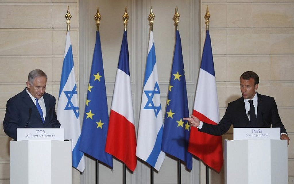 French President Emmanuel Macron, right, speaks as Prime Minister Benjamin Netanyahu listens during a joint press conference after their meeting at the Elysee Palace in Paris, on June 5, 2018. 
(PHILIPPE WOJAZER/AFP)