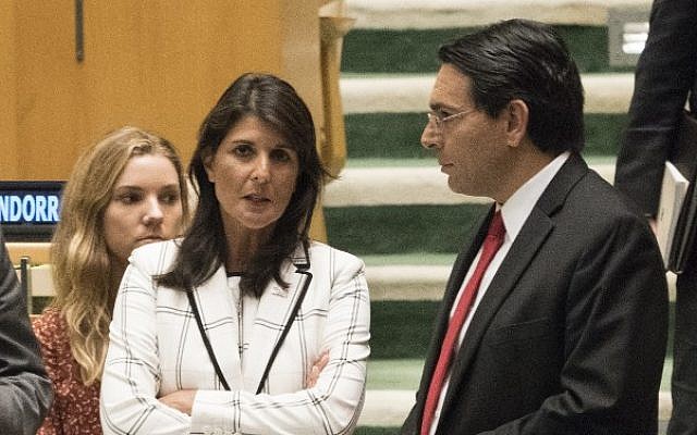 US Ambassador to the United Nations Nikki Haley talks with Israel's Ambassador to the UN Danny Danon before a vote in the General Assembly, June 13, 2018 in New York. (AFP Photo/Don Emmert)