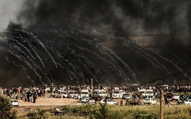 Israeli forces fire tear gas at demonstrators east of Gaza City along the border between the Gaza Strip and Israel, on June 29, 2018, during confrontations with Palestinian protesters. (AFP PHOTO / MAHMUD HAMS)