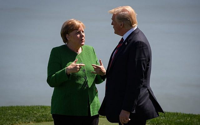 Germany's Chancellor Angela Merkel, left, and US President Donald Trump on the first day of the G7 Summit, in La Malbaie, Canada, on June 8, 2018. (Leon Neal/Getty Images/AFP)