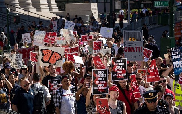 Illustrative: Activists march and rally against Immigration and Customs Enforcement (ICE) and the Trump administration's immigration policies, across the street from the ICE offices at Federal Plaza, June 29, 2018 in New York City. (Drew Angerer/Getty Images/AFP)