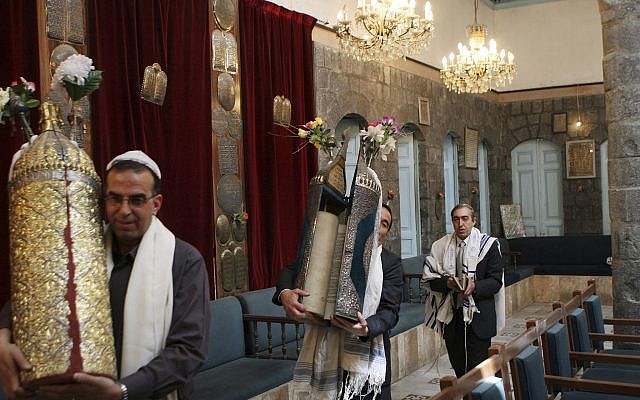 In this April 20, 2008, file photo, Syrian Jews celebrate Passover at the al-Firenj Synagogue in downtown Damascus, Syria. (AP Photo/Bassem Tellawi, File)