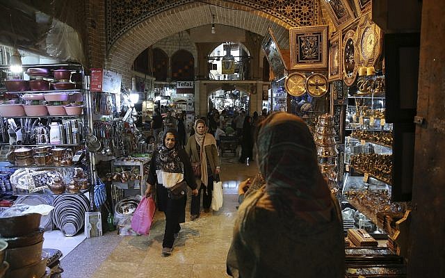 People shop at the old main bazaar in Tehran, Iran, Saturday, June 9, 2018. (AP Photo/Vahid Salemi)