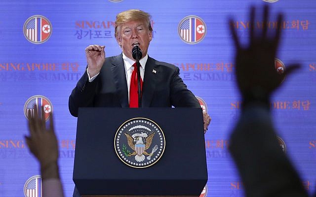 US President Donald Trump answers questions about the summit with North Korean leader Kim Jong Un during a press conference at the Capella resort on Sentosa Island, Singapore, on June 12, 2018. (AP Photo/Evan Vucci)