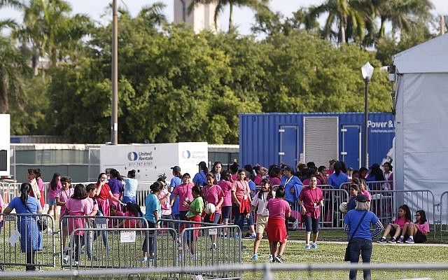 Immigrant children play outside a former Job Corps site that now houses them, Monday, June 18, 2018, in Homestead, Florida. (AP Photo/Wilfredo Lee)