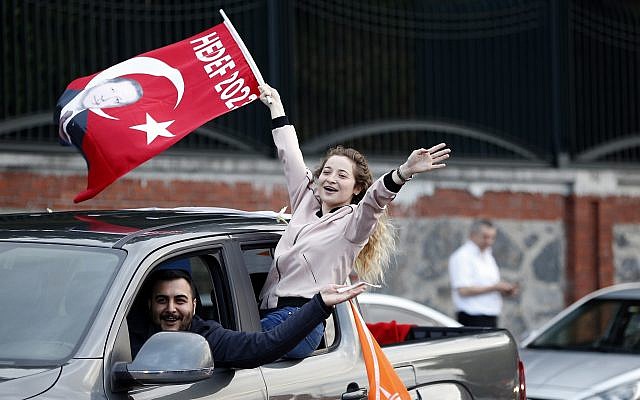 Supporters of Turkey’s President and ruling Justice and Development Party, or AKP, leader Recep Tayyip Erdogan celebrate outside his official residence in Istanbul, June 24, 2018. (AP Photo/Lefteris Pitarakis)