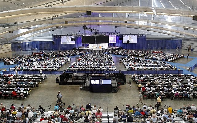 Illustrative image of people attending the 220th General Assembly (2012) of the Presbyterian Church (USA) at the David Lawrence Convention Center in Pittsburgh listen to a session on Thursday, July 5, 2012. (AP Photo/Keith Srakocic)