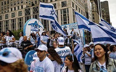 People carry Israeli flags as they march during the annual Celebrate Israel Parade, June 3, 2018, in New York. (AP Photo/Andres Kudacki)