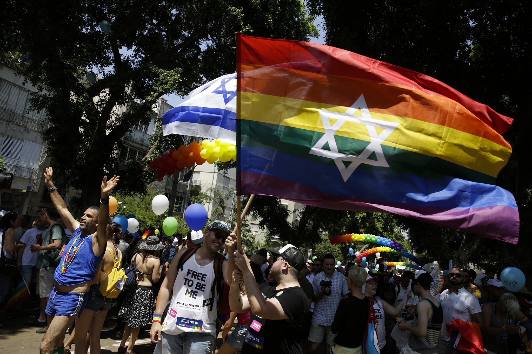 Revelers take to the streets of Tel Aviv for region's largest Pride