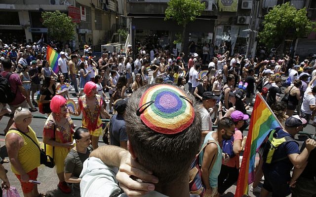 Israelis participate in the Gay Pride parade in Tel Aviv on Friday, June 8, 2018. (AP Photo/Sebastian Scheiner)